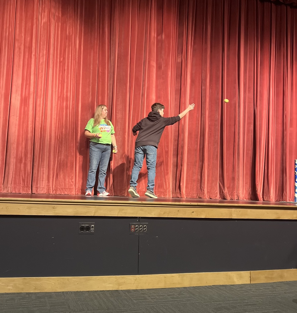 Students participating in a event during a presentation from the American Heart Association. 