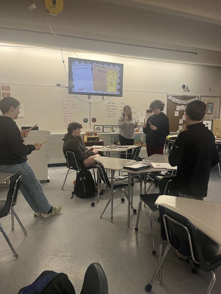 Students participating in social studies class.