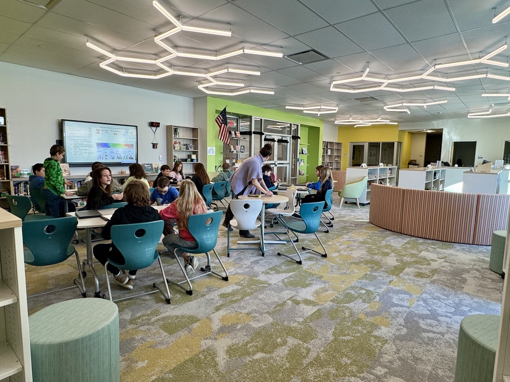 Students using the beautiful new library at the new school. 