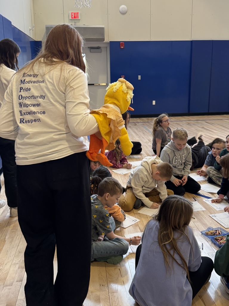 Students observing a puppet show.