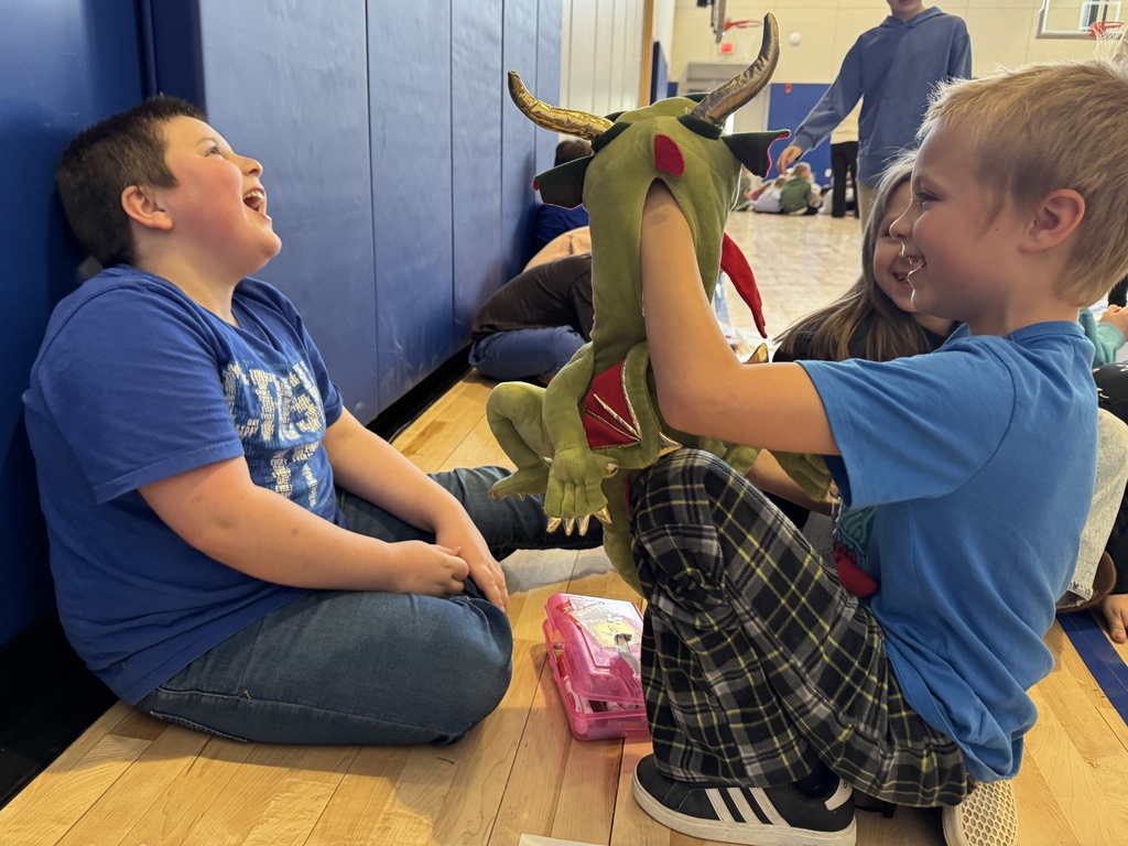 Students observing a puppet show.