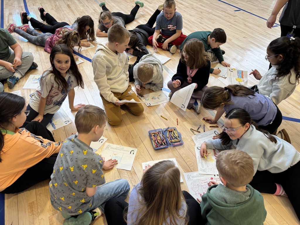 Students observing a puppet show.