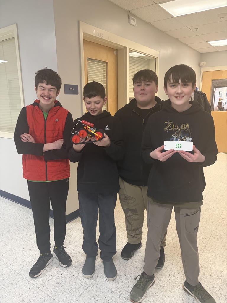 Students showing off their scrapbook pages of all they  have learned.