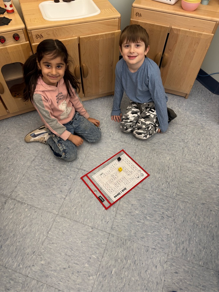 Picture of students learning with playing games.