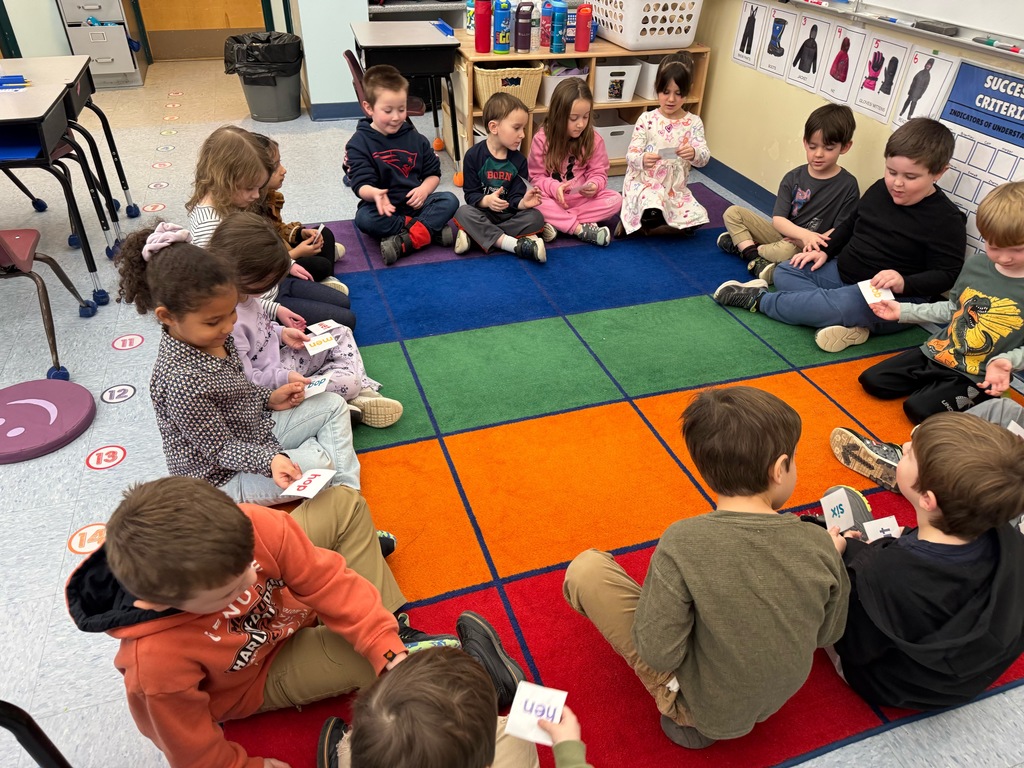 Picture of students learning with playing games.