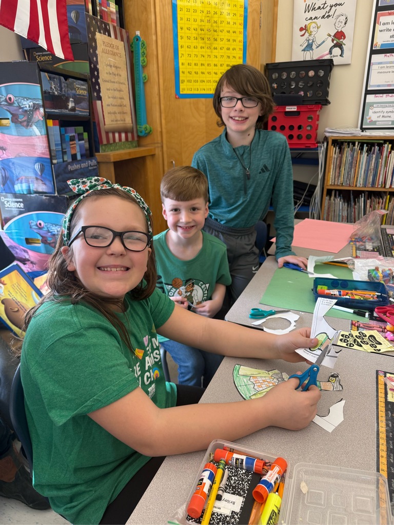 Pictures of students participating in buddy day and working on st patrick day crafts. 