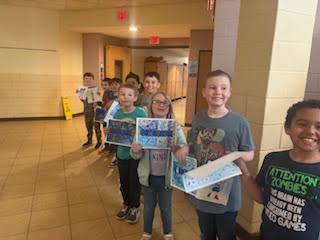 Pictures of students visiting the girls high school basketball team and celebrating their victory. 