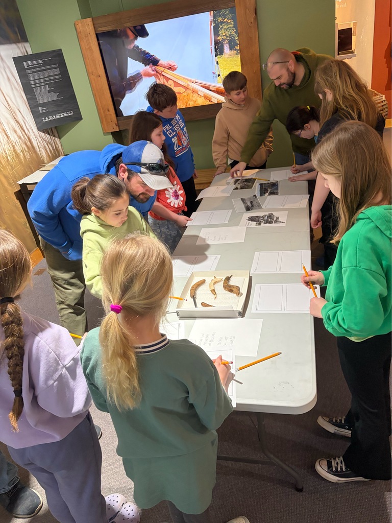 Students participating in a lesson during a field trip.