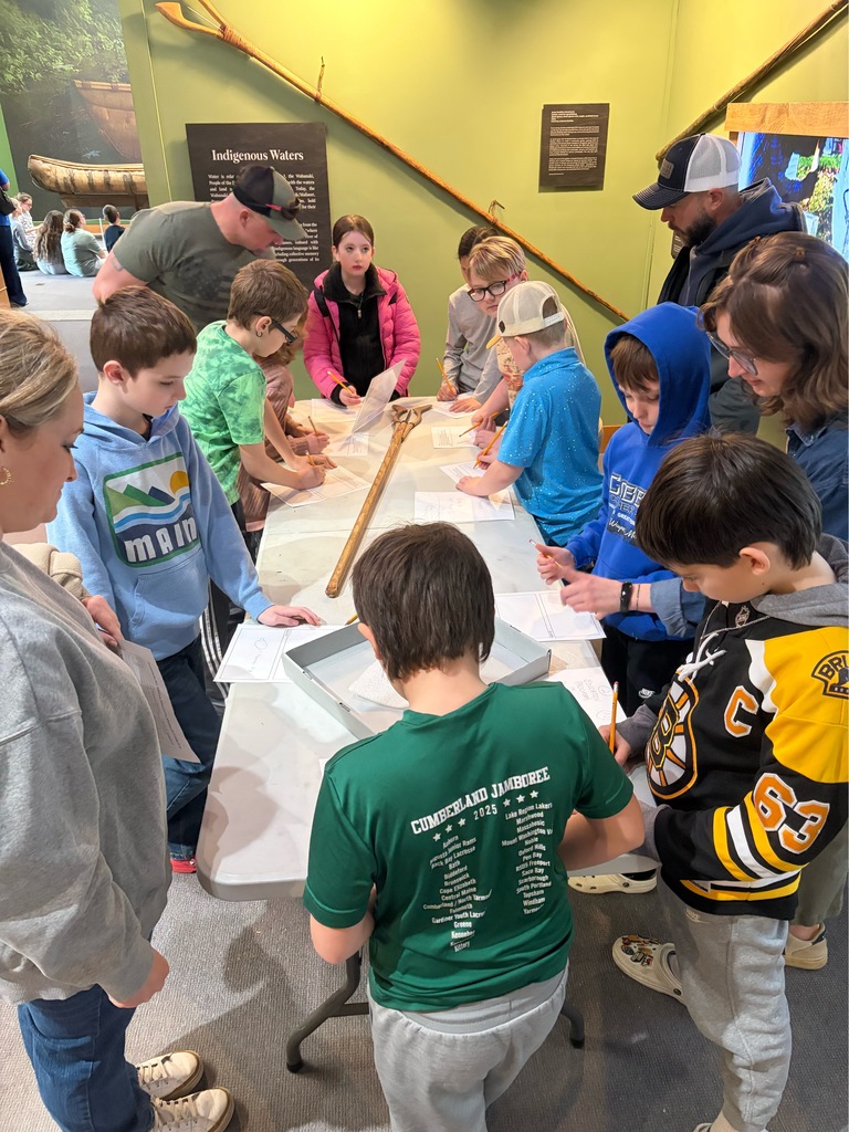 Students participating in a lesson during a field trip.