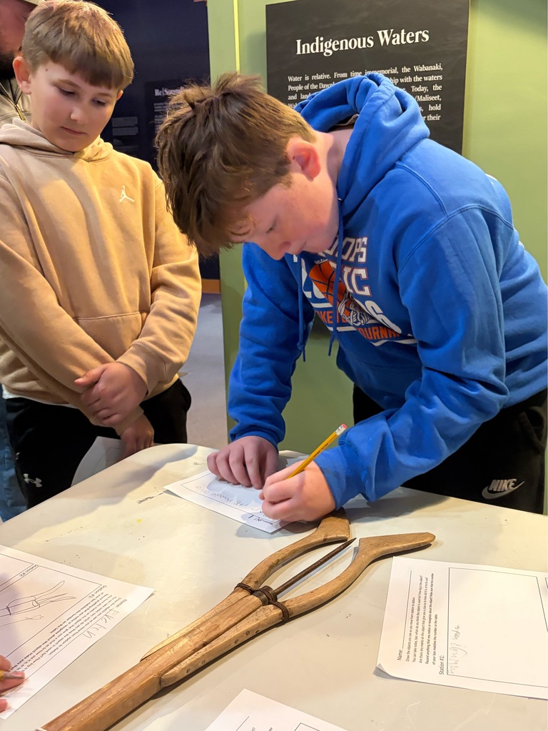 Students participating in a lesson during a field trip.