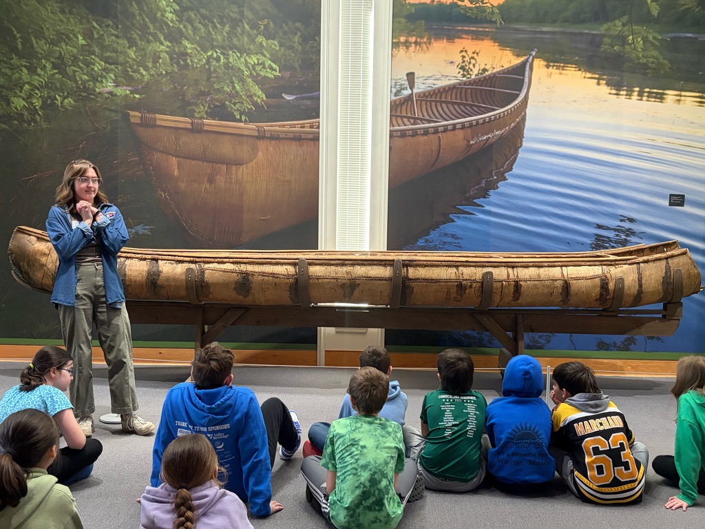 Students participating in a lesson during a field trip.