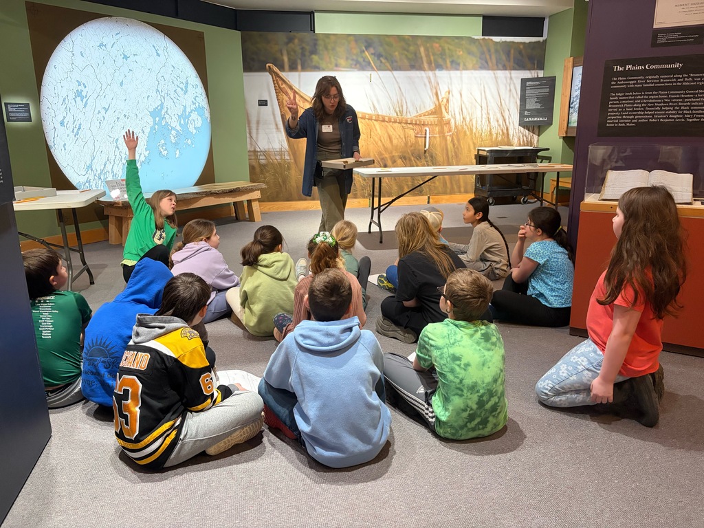 Students participating in a lesson during a field trip.