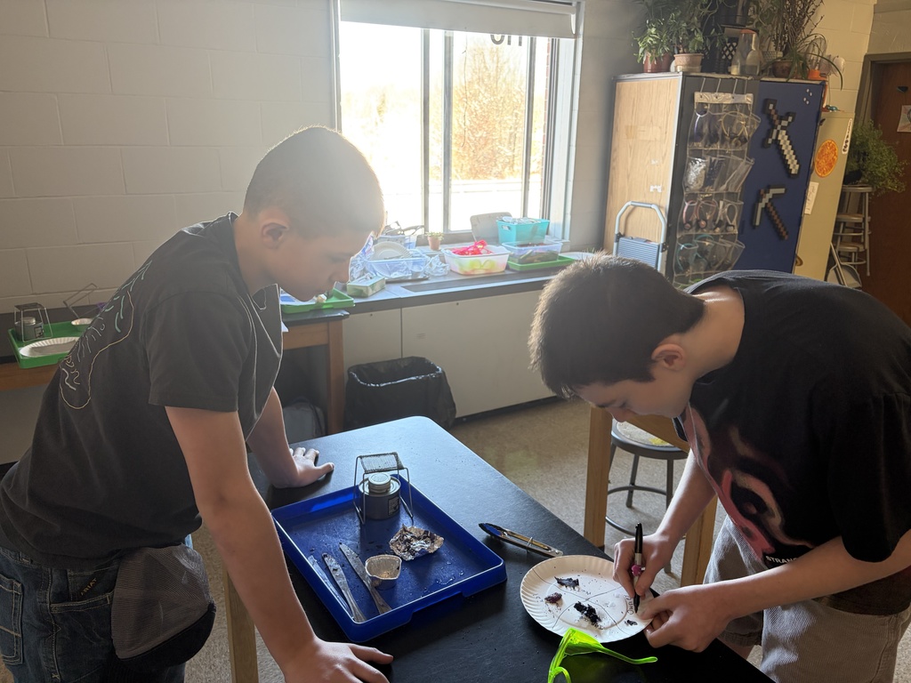 8th graders explore tectonic plate movements using graham crackers, marshmallows, and chocolate