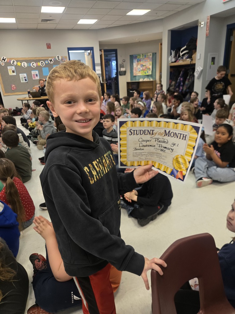 Students being celebrated for being the students of the month.