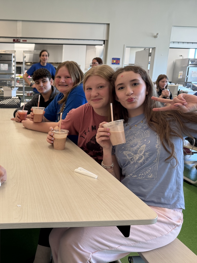 fourth graders enjoying a ice cream sundae party after winning our March attendance competition