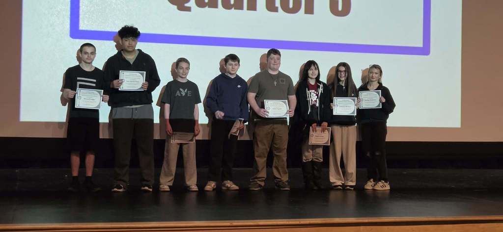 Students being celebrated for being the students of the month.