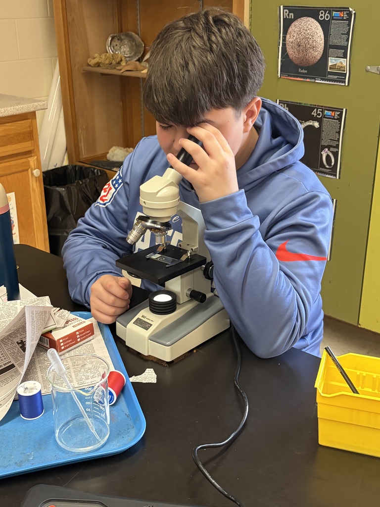 students working on hand on science. 