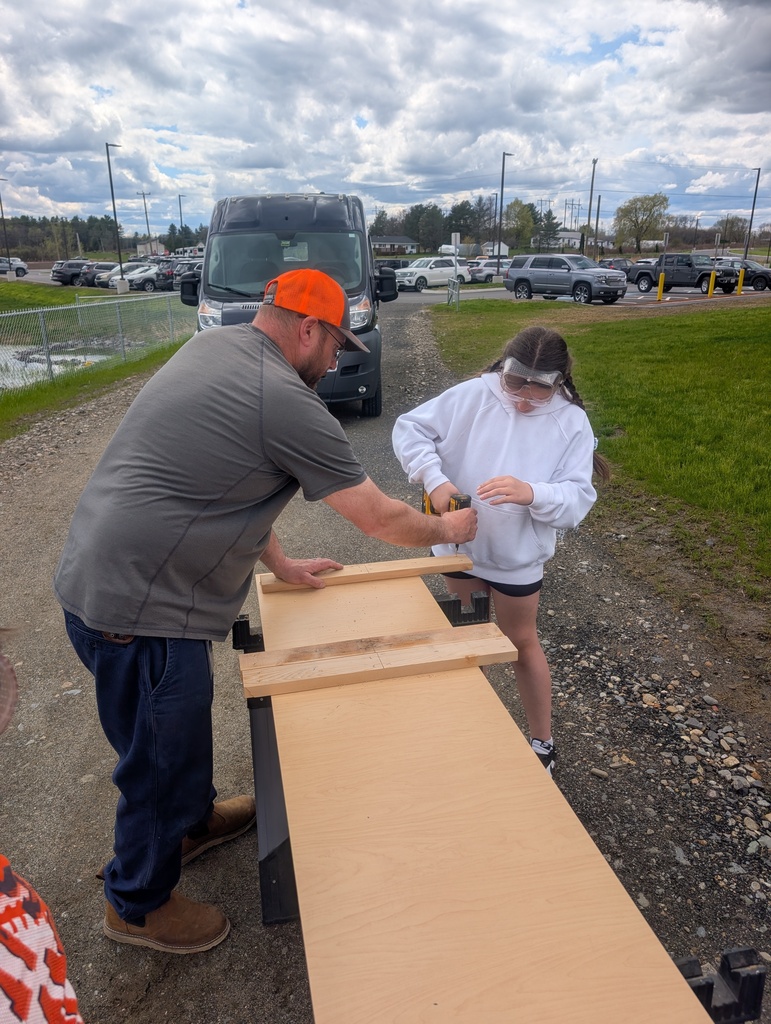 students learning how to build raised gardens.