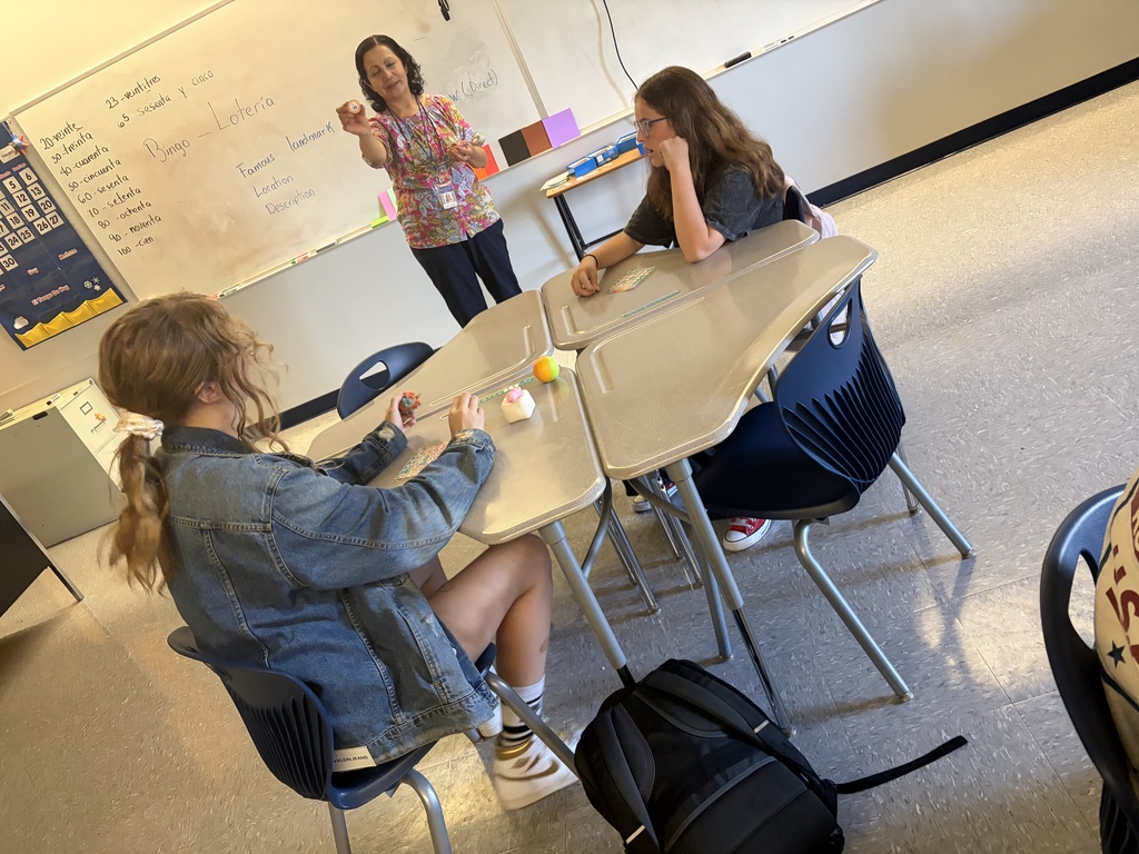 Students learn colors and numbers in Spanish Class by playing bingo.