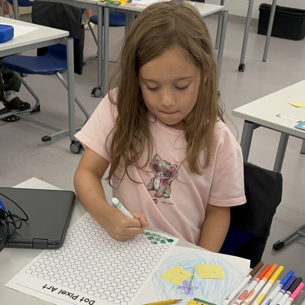 Female student doing dot pixel art.