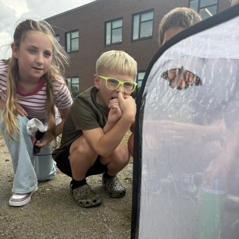 Students releasing butterflies