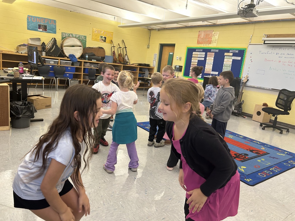 Students learn how to "Sashai" in music class.