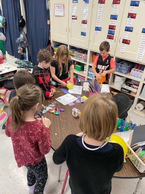 students working on balloon projects.