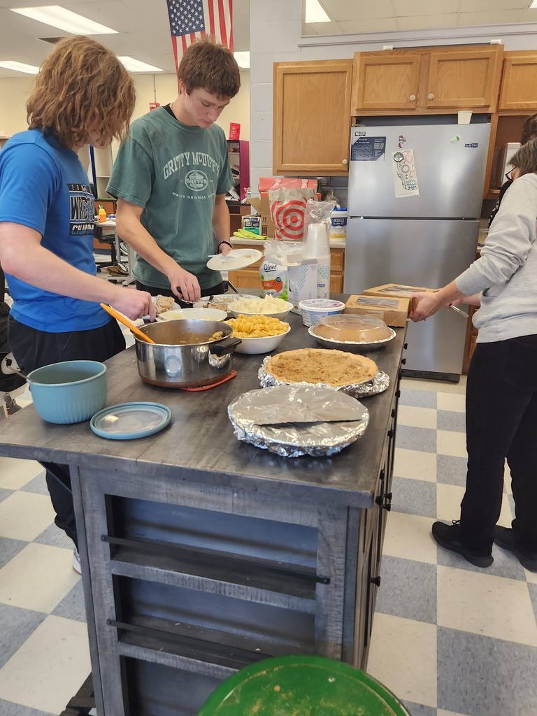 Students preparing a Thanksgiving meal at school.