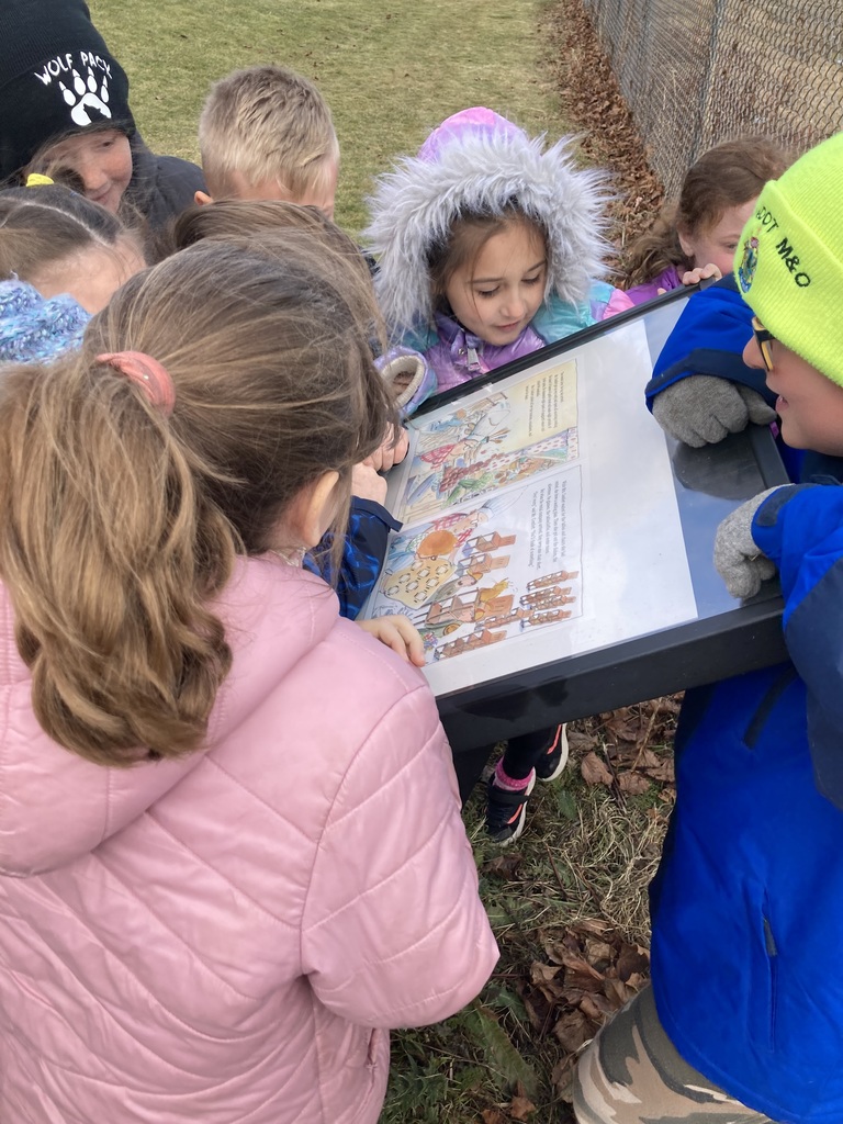 Students participating in a story walk.