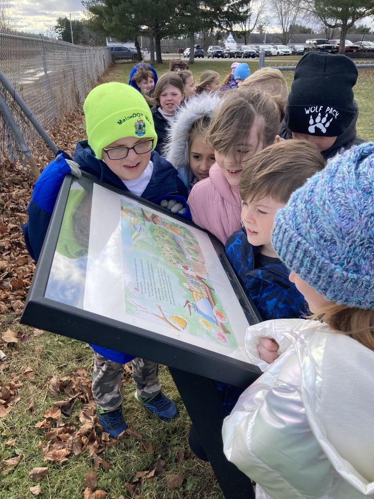 Students participating in a story walk.