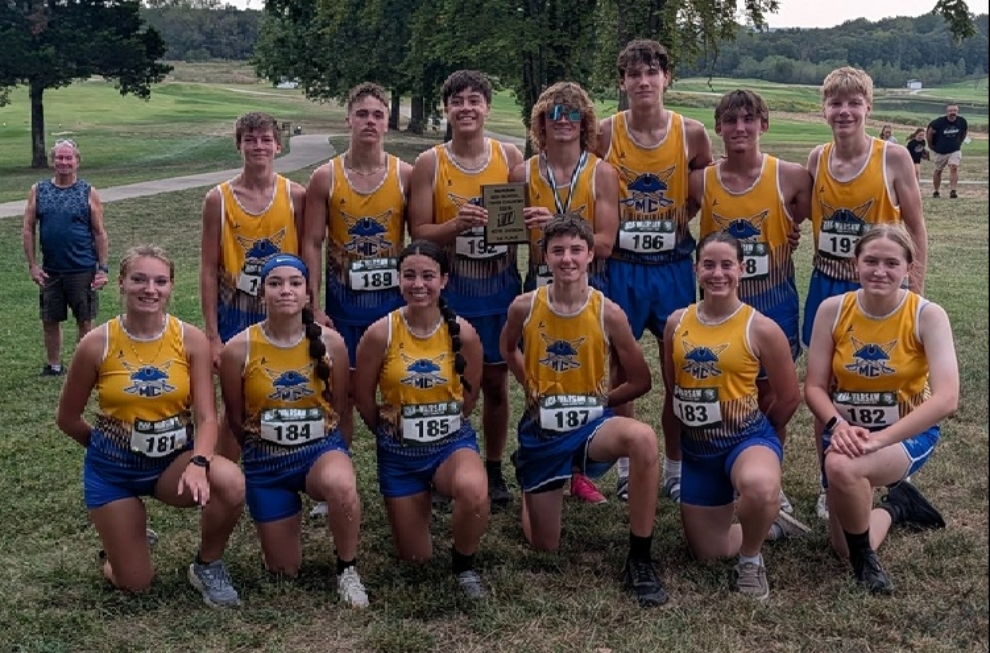 Both the Girls and Boys Cross Country Teams pose for a photo following the Warsaw Invitational