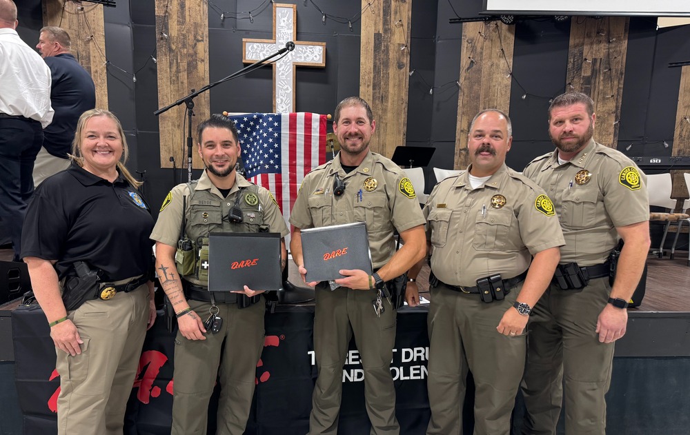 From left to right, Corporal Kandi Greer (SRO of Stoutland Schools), Deputy Ricky DeYoe (SRO of Macks Creek School), Deputy Chris Clarke (SRO of Climax Springs School), Colonel Scott Hines (Chief Deputy of the CCSD) and Sheriff Chris Edgar pose for a photo following this year’s D.A.R.E. officer training graduation ceremony.
