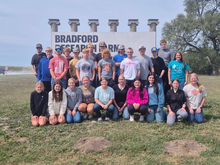 Students in front of Bradford Research Farm Sign