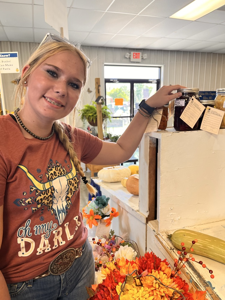 Grace Deckard with her canned good entry.