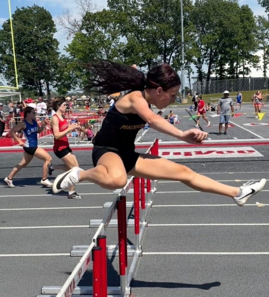 Kloe Hoback clears the hurdle 
