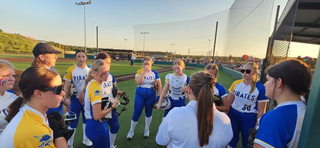 Coach visits with the team.