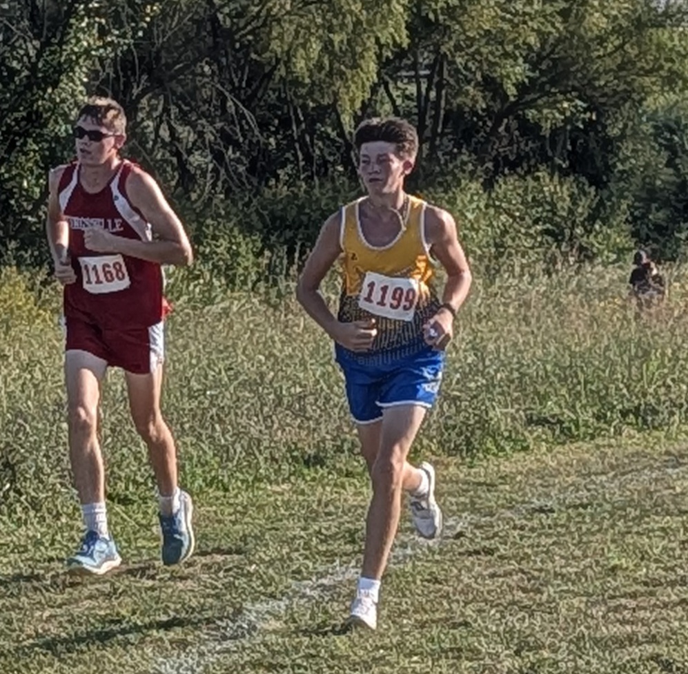 Fisher makes a move to overtake a competitor.