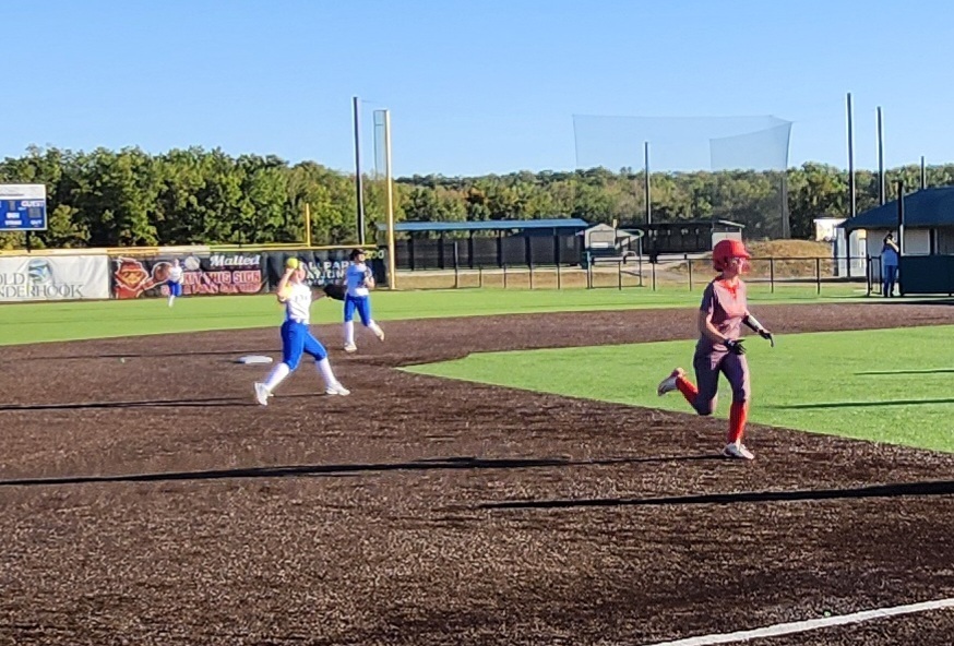 Madison fielding and making the throw to 1st.