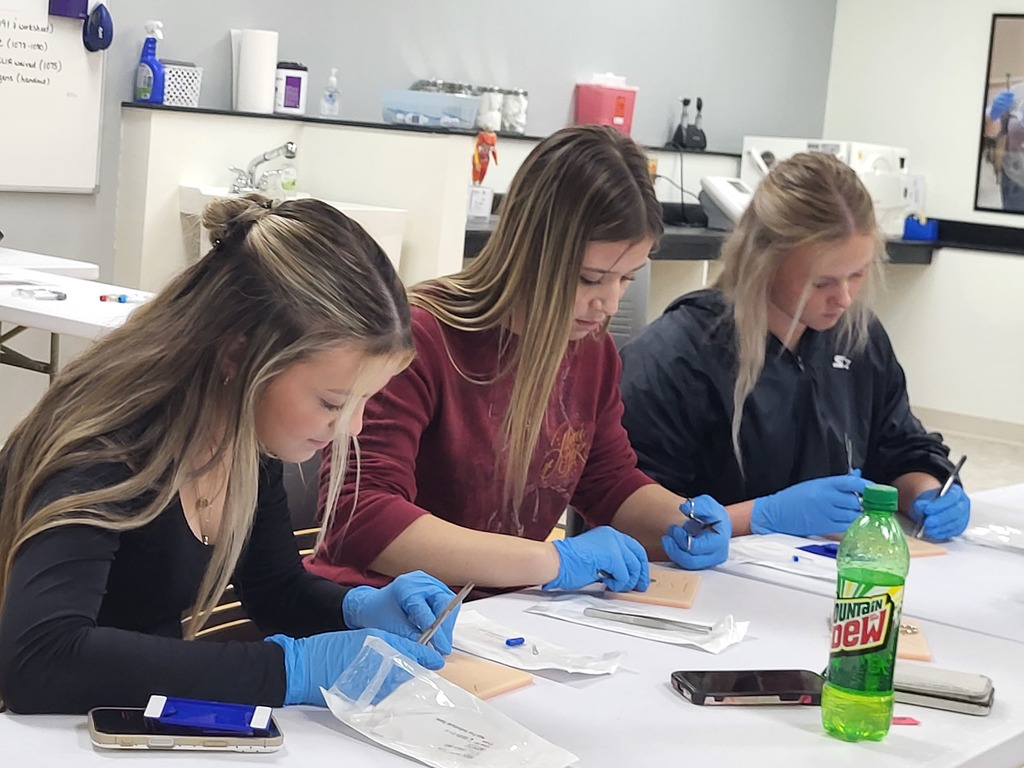 Alayna, Sarianna and Morgan participate in hands-on activity as a part of the their visit to SFCC to learn more about the Medical Assistant Program. 