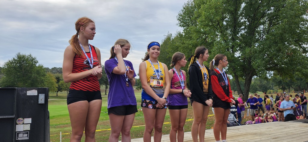 Allie on the Medal Stand being recognized for her All District performance.