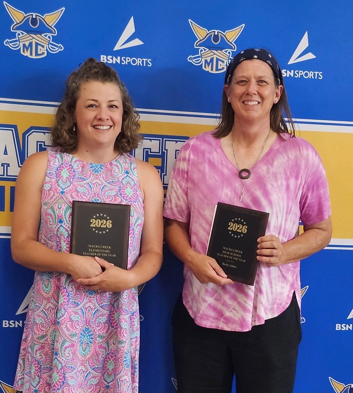 Kelsey and Becky pose with their awards