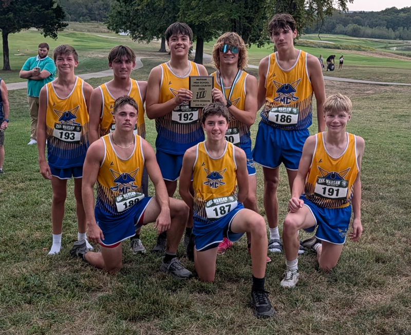 The boys team poses with the 2nd Place Plaque