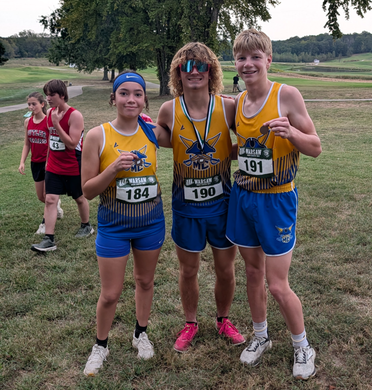 Allie, Carter and Karsyn pose with their medals.