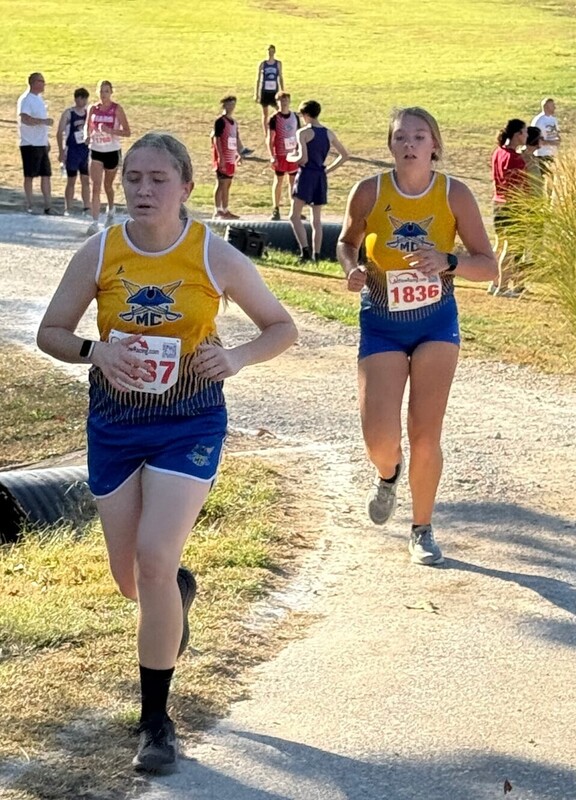 Kelsie and Bailey ran well at Dixon securing the chance for the Lady Pirates to win the meet! Both are running together here.
