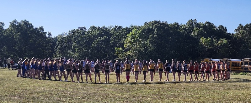 Racers gather to pray before the starting gun sounds.