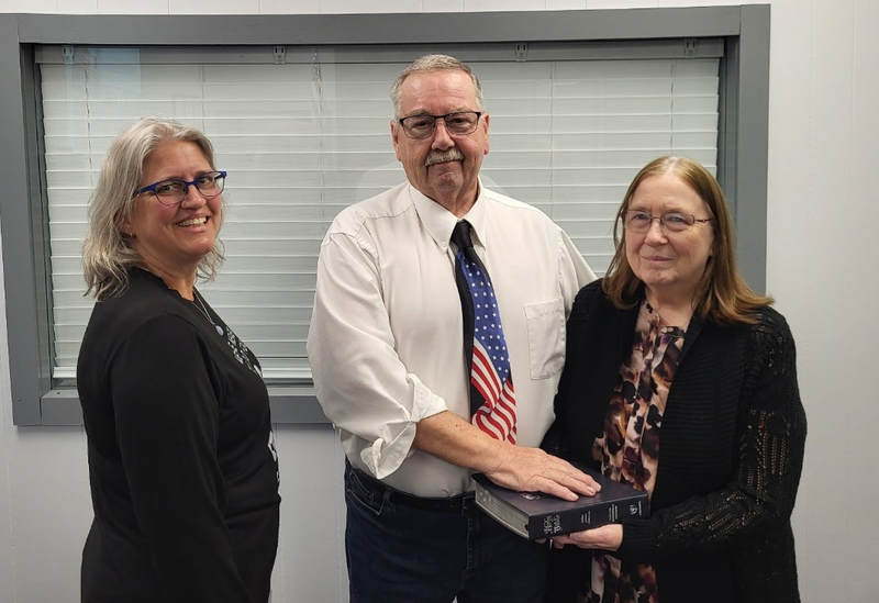 Don is sworn in while his wife holds the Bible 