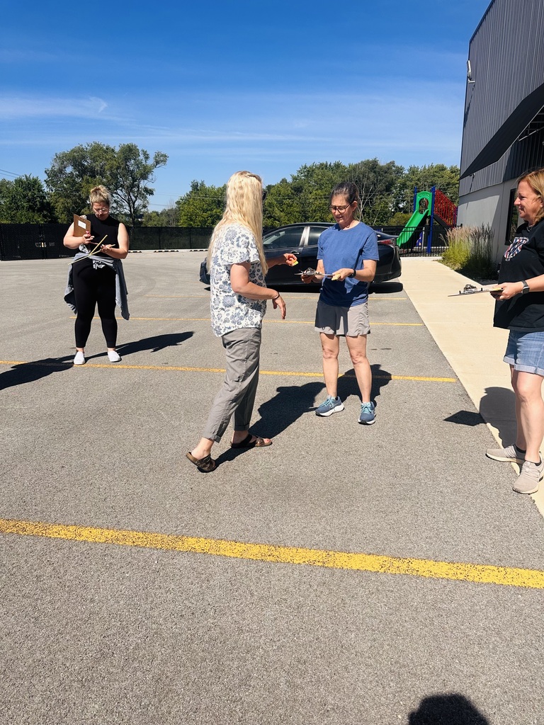 Instructor helping with outdoor activity