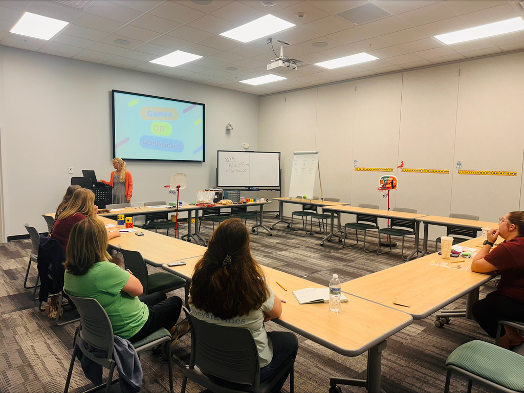 Educators interacting in classroom games during professional development