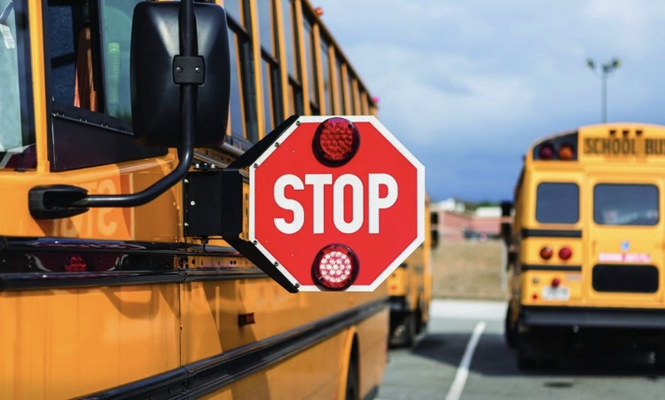 Bus with Stop sign out. 