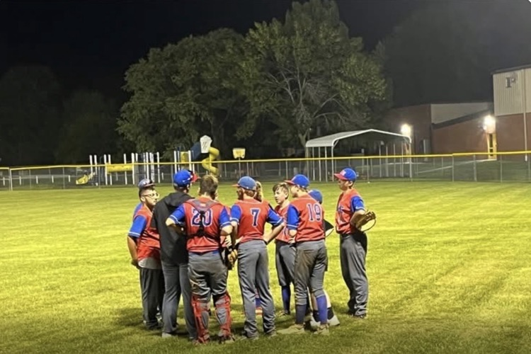 baseball team gathered after a win at Madison.